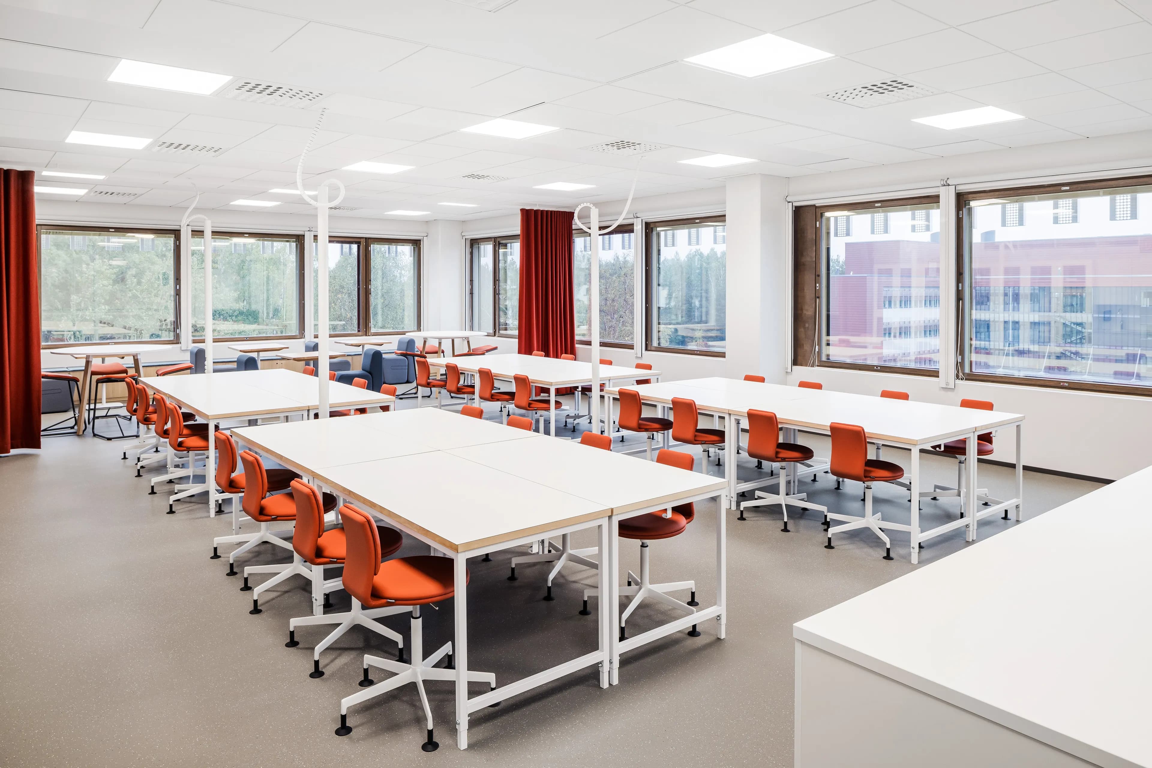 Classroom with red chairs at Helsinki Upper-Secondary School of Languages.